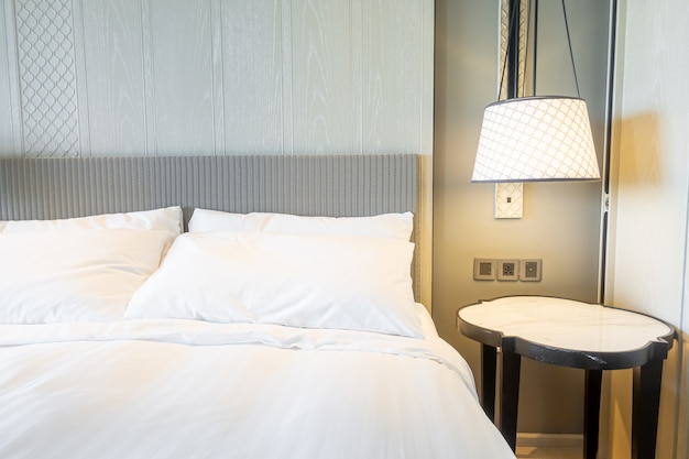 white pillows decoration on bed in bedroom interior