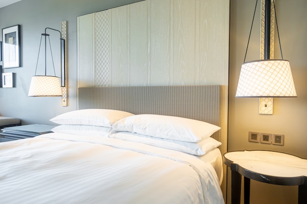 white pillows decoration on bed in bedroom