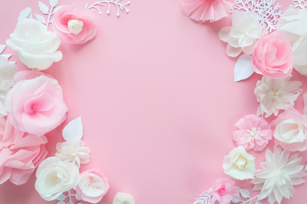 White and pink paper flowers on pink