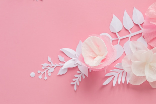 White and pink paper flowers on pink