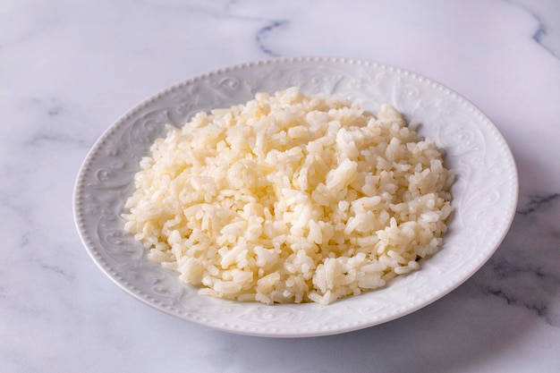 White plain rice pilaf from traditional delicious Turkish or Chinese cuisine. Boiled rice. Turkish name; Sade pirinc pilavi, pirinc haslama or haslanmış pirinc.