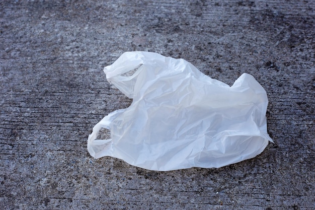 White plastic bag on cement floor