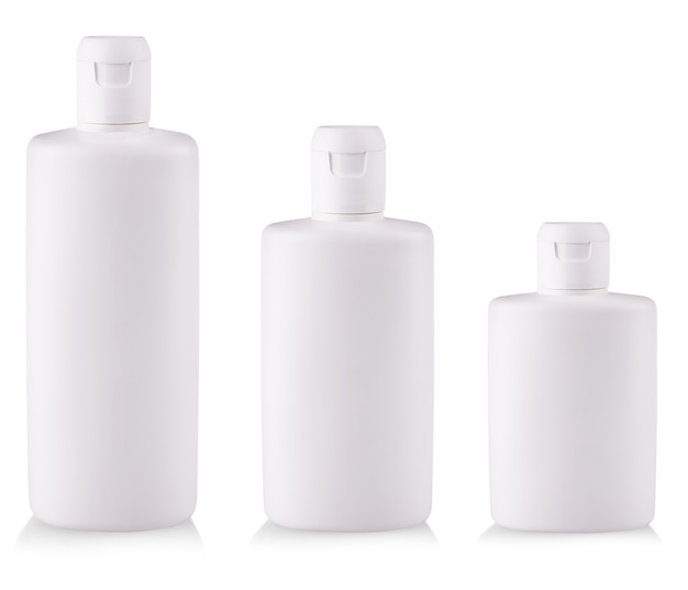 The white Plastic bottles with soap or shampoo without label reflected on white background