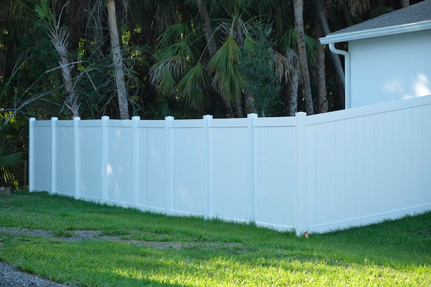 White plastic fence for back yard protection and privacy