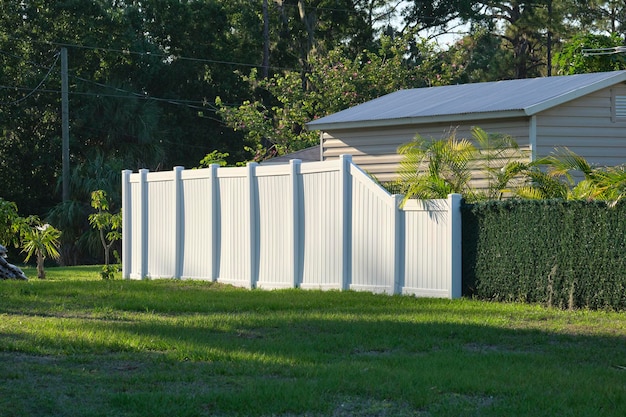 White plastic fence for back yard protection and privacy