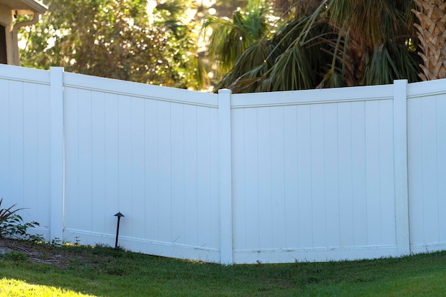 White plastic fence for back yard protection and privacy