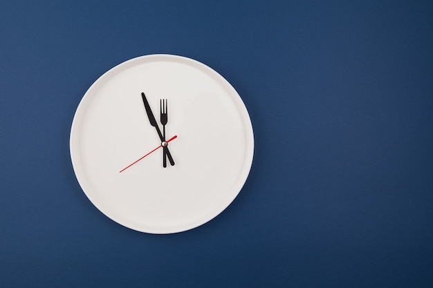 White plate clock on blue