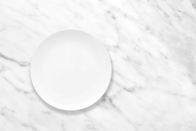 White plate on marble stone table, plate mockup, top view