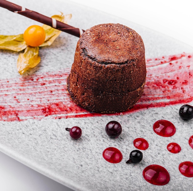 White plate with chocolate fondant cake