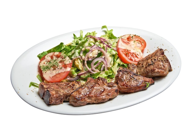 White plate with lamb chops and salad Isolated