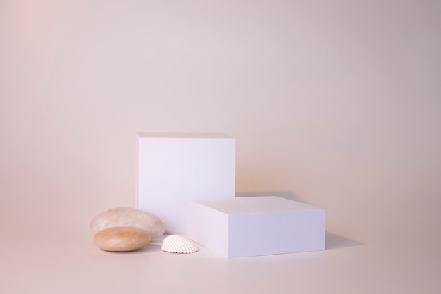 White podium on the white background. Podium for product, cosmetic presentation. Creative mock up. Pedestal or platform for beauty products. Minimalist design.