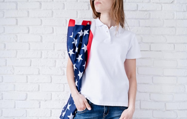 White polo shirt on woman over USA flag background mockup design