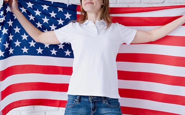 White polo shirt on woman over USA flag background mockup design