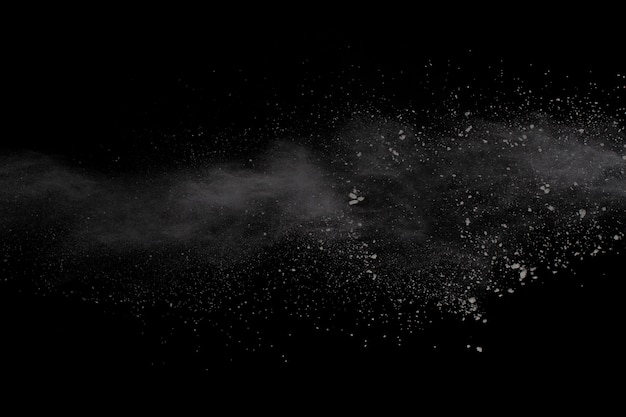 White powder explosion on black background. Colored cloud. Colorful dust explode. Paint Holi. 