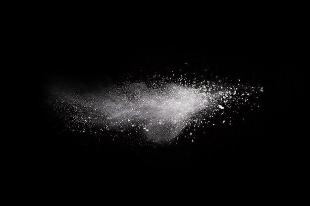 White powder explosion on black background. Colored cloud. Colorful dust explode. 