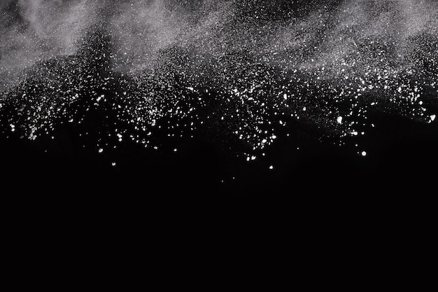 Photo white powder explosion on black background. colored cloud. colorful dust explode. 