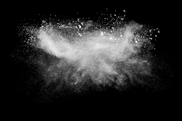 White powder explosion cloud against black background White dust particles splash