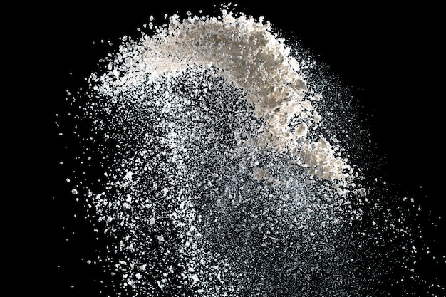 White powder explosion isolated on black background for graphic resources