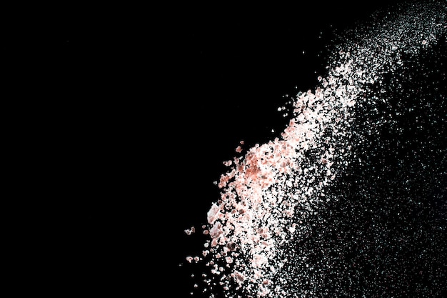 White powder explosion isolated on black background for graphic resources