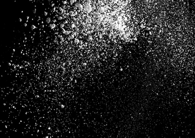 White powder explosion isolated on black background for graphic resources