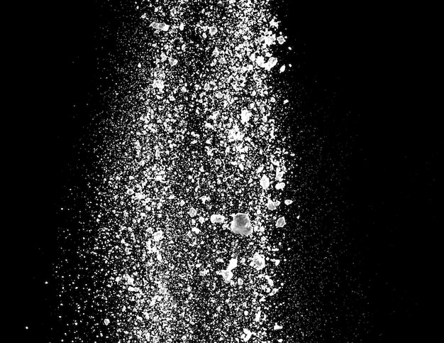 White powder explosion isolated on black background 