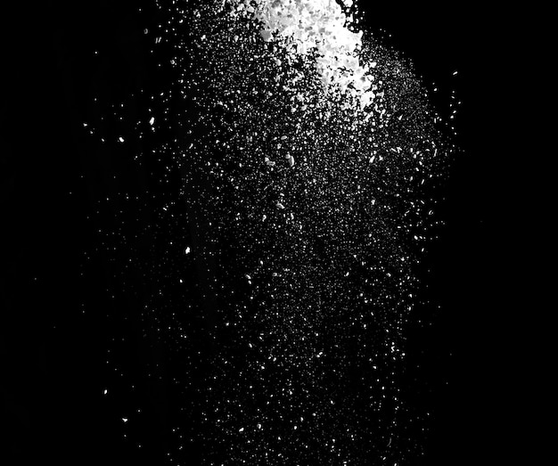 White powder explosion isolated on black 