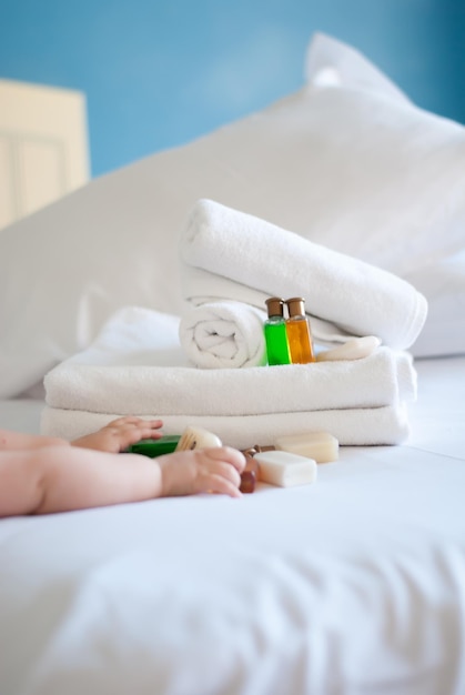 White pure towels on bed in the hotel