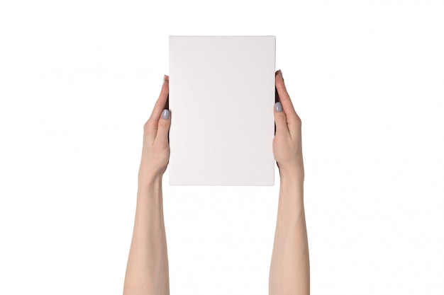 White rectangular box in female hands.