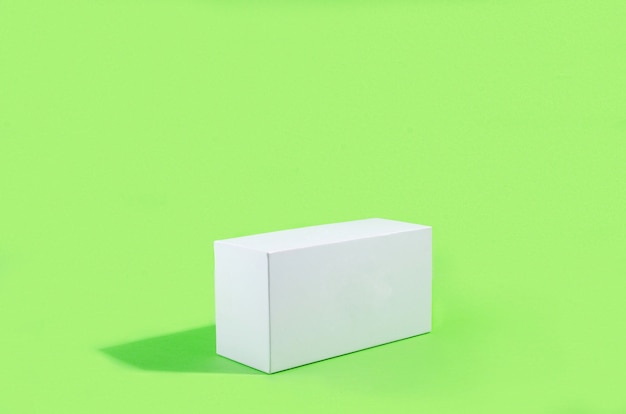 white rectangular with shadows on green background