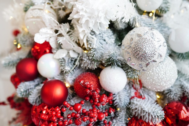 White and red Christmas decoration with balls on fir tree