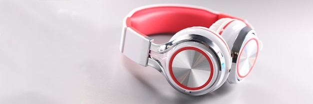 White red wireless headphones on gray background