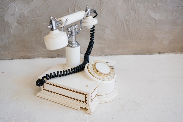 White retro phone vintage items and accessories in the interior collecting and selling antique equipment