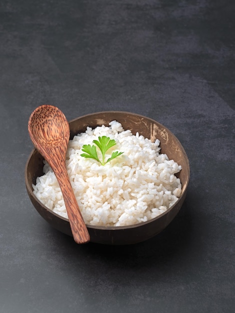 White rice in the bowl with dark background