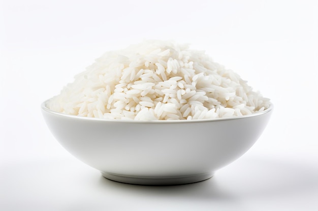 White rice grains in a bowl isolated on white background Concept of food staple raw grains cooking ingredient healthy food