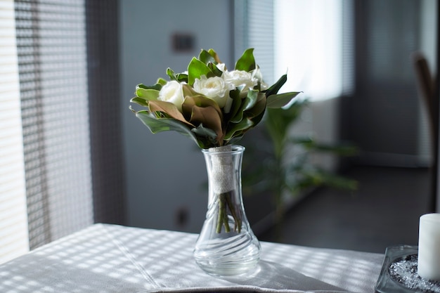 White roses bouquet in a crystal vase