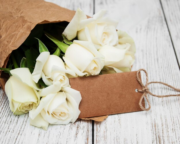 White roses with tag