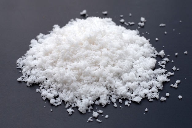 White salt on dark background.