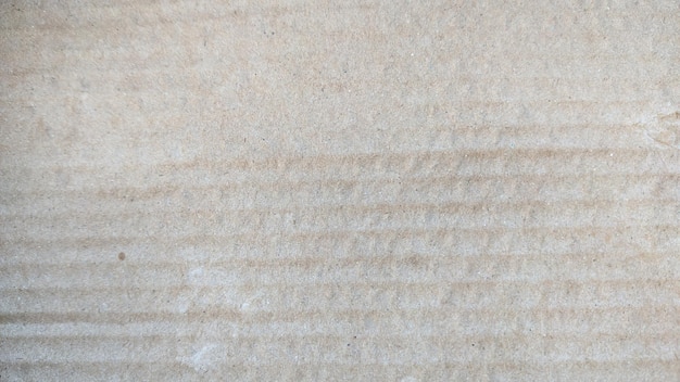 A white sand with a pattern of lines on it.