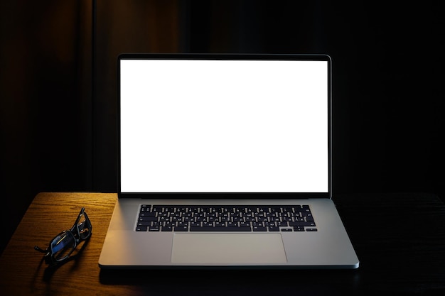 White Screen Laptop On Black Background Mockup