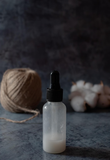 White serum bottle homemade skincare product organic zero waste cosmetics selective focus