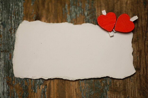 White sheet of paper love notes and heart shape