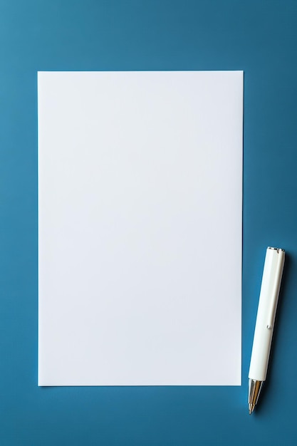 Photo a white sheet of paper with a blue background with a pencil on it