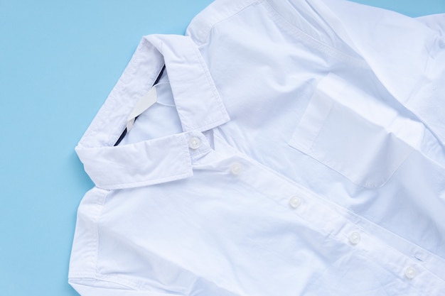 A white shirt with autumn leaves in the pocket