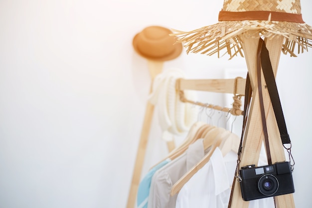 White shirts hanging on wooden cloths racks