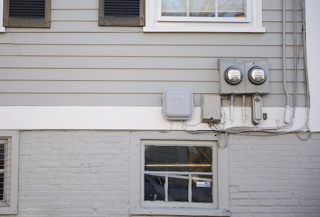 A white sign on a building says " the word " on it "