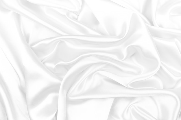 White silk texture luxurious satin for abstract background. beautiful white fabric, soft focus