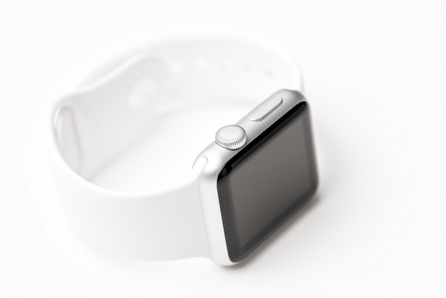 Photo white smart watch located on a white surface