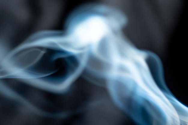 white smoke on black background abstract shapes