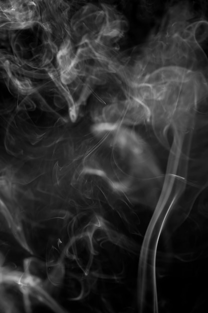 White smoke on black background