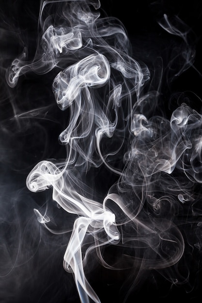 White smoke on black background.